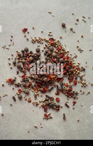 Spices scattered on a gray background, top view Stock Photo