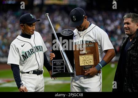 Seattle Mariners greats Edgar Martinez, left, and Ken Griffey Jr. pose for  photos after they raised a flag for the 2023 All-Star Game on the roof of  the Space Needle, Thursday, Sept.