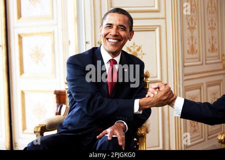 President Barack Obama shakes hands with French President Nicolas Sarkozy during a bilateral meeting in Caen, France, June 6, 2009.  (Official White House photo by Pete Souza) This official White House photograph is being made available for publication by news organizations and/or for personal use printing by the subject(s) of the photograph. The photograph may not be manipulated in any way or used in materials, advertisements, products, or promotions that in any way suggest approval or endorsement of the President, the First Family, or the White House. Stock Photo