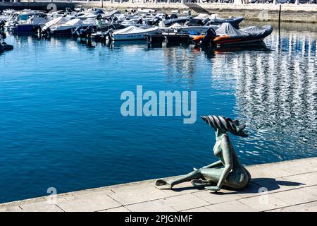 The statue of a mermaid sitting in the port of Faro, Portugal. Stock Photo