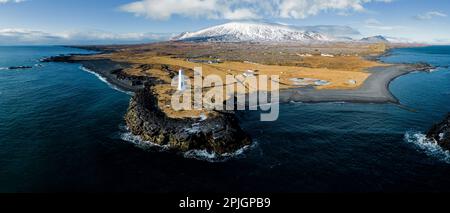 Aerial panorama of Malarrif Lighthouse with Snæfellsjökull volcano in the background Stock Photo
