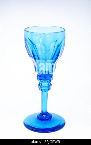 An antique, blue stemmed glass by Apsley Pellet isolated against a white background. Stock Photo