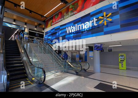 People enter a Walmart at H Street, Washington DC in its final week as the retailer is closing this store and others in urban areas. March 29, 2023 Stock Photo