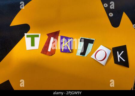 The word "TikTok" using cut-out paper letters in the ransom note effect typography Stock Photo