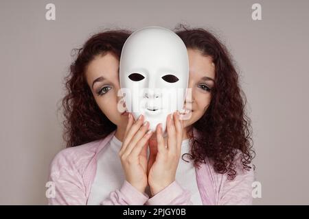 two-faced happy sad woman manic depression or schizophrenia concept Stock Photo