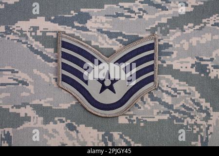 August 31, 2020. US AIR FORCE Staff Sergeant rank patch on digital tiger-stripe pattern Airman Battle Uniform (ABU) Stock Photo