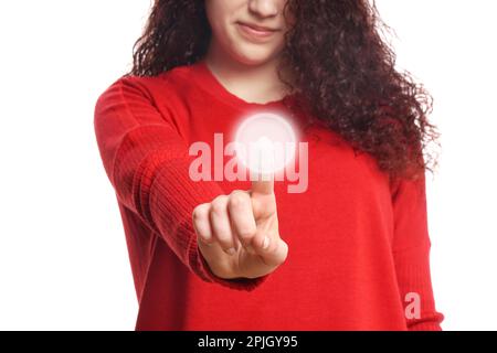 young woman pressing virtual button on touch screen Stock Photo