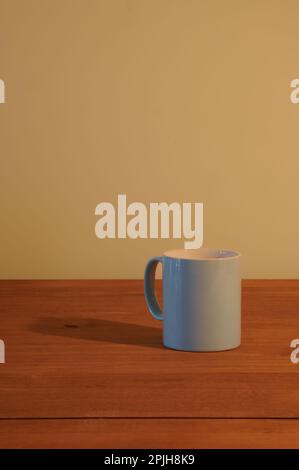 Blue mug on an empty wooden table Stock Photo