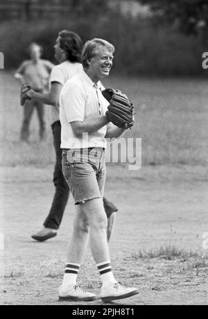 Jimmy Carter plays softball in his hometown of Plains, Georgia. Carter was pitcher and captain of his team that was comprised of off duty U.S. Secret Service agents and White House staffers. The opposing team was comprised of members of the White house traveling press and captained by Billy Carter, the president's brother. - To license this image, click on the shopping cart below - Stock Photo