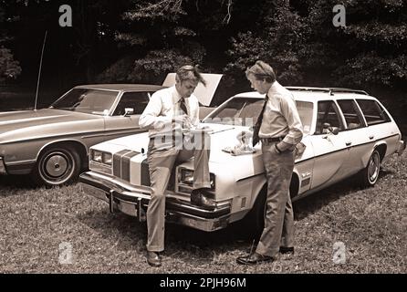 Carter and Mondale get away from the crowd for a privatetalk while attending a church picnic at Plains Baptist. Stock Photo