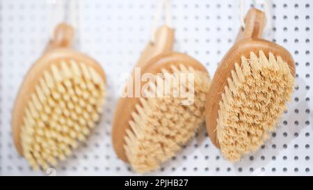 kitchen brushes hang in supermarket Stock Photo