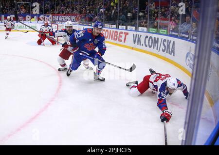 Saint Petersburg, Russia. 02nd Apr, 2023. SKA Hockey Club player, Dmitry Jaskin (No.23) and CSKA Hockey Club player, Maxim Mamin (No.98), Artyom Sergeyev (No.93) seen in action during the Kontinental Hockey League, Gagarin Cup, match 1, final of the Western Conference season KHL 2022 - 2023 between SKA Saint Petersburg and CSKA Moscow at the Ice Sports Palace.(Final score; SKA Saint Petersburg 2:3 CSKA Moscow) Credit: SOPA Images Limited/Alamy Live News Stock Photo