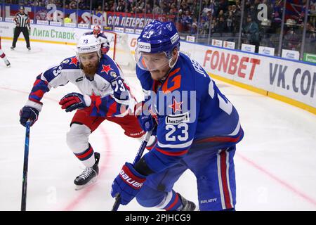 Saint Petersburg, Russia. 02nd Apr, 2023. CSKA Hockey Club player, Yaroslav Dyblenko (No.73) and SKA Hockey Club player, Dmitry Jaskin (No.23) seen in action during the Kontinental Hockey League, Gagarin Cup, match 1, final of the Western Conference season KHL 2022 - 2023 between SKA Saint Petersburg and CSKA Moscow at the Ice Sports Palace. (Final score; SKA Saint Petersburg 2:3 CSKA Moscow) Credit: SOPA Images Limited/Alamy Live News Stock Photo