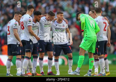 Bolton Wanderers players form a huddle during the Papa John's Trophy Final match Bolton Wanderers vs Plymouth Argyle at Wembley Stadium, London, United Kingdom, 2nd April 2023  (Photo by Gareth Evans/News Images) Stock Photo