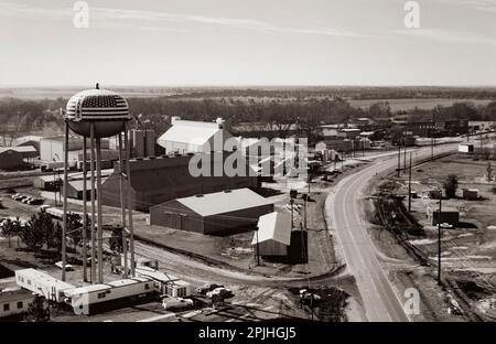 Aerial photograph of Plains, Georgia in 1976 as Jimmy Carter wins the US presidential election. Carter Warehouse and a trailer - based broadcast center - nicknamed TV City - stands under the red, white and blue water tower. Stock Photo