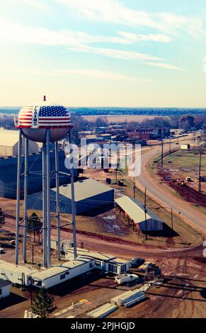 Aerial photograph of Plains, Georgia in 1976 as Jimmy Carter wins the US presidential election. Carter Warehouse and a trailer - based broadcast center - nicknamed TV City - stands under the red, white and blue water tower. Stock Photo