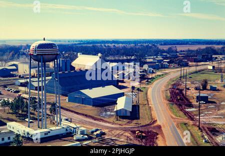 Aerial photograph of Plains, Georgia in 1976 as Jimmy Carter wins the US presidential election. Carter Warehouse and a trailer - based broadcast center - nicknamed TV City - stands under the red, white and blue water tower. Stock Photo