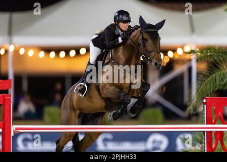 Jacqueline Steffens-Daley from Canada competes at a Major League Show Jumping event at Desert International Horse Park in Coachella, California. Stock Photo