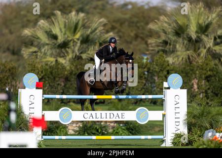 Jacqueline Steffens-Daley from Canada competes at a Major League Show Jumping event at Desert International Horse Park in Coachella, California. Stock Photo