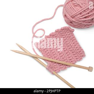 Soft pink woolen yarn, knitting and wooden needles on white background, top view Stock Photo