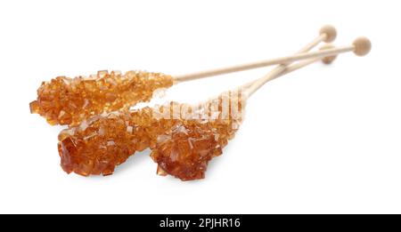Wooden sticks with sugar crystals isolated on white. Tasty rock candies Stock Photo