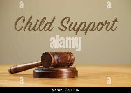 Judge's gavel on wooden table. Child support concept Stock Photo