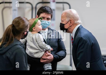 President Joe Biden greets Ret. U.S. Marine Cpl. William Kiernan, his wife Leah, and their daughter Madison Friday, Jan. 29, 2021, during a visit to Walter Reed National Military Medical Center in Bethesda, Maryland. Cpl. Kiernan was injured in 2010 while deployed to Afghanistan where he suffered a right below knee amputation from an improvised explosive device attack. (Official White House Photo by Adam Schultz) Stock Photo