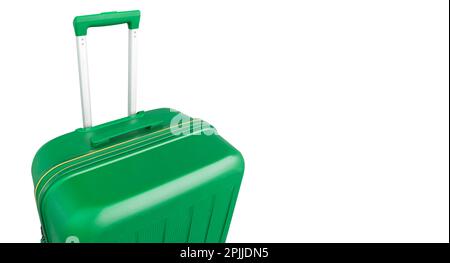 Front view of green suitcase with long telescopic handle isolated on white background. Suitcase isolated. Green fashionable travel suitcase. Travel lu Stock Photo