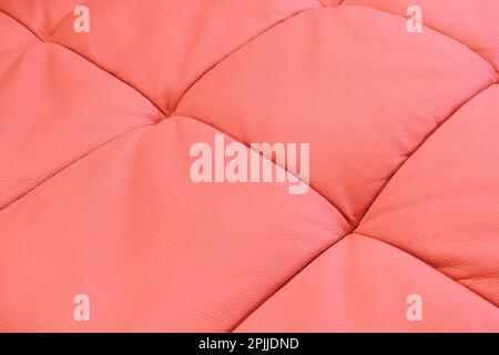 Red leather texture. Part of perforated leather details. Red perforated leather texture background. Texture, artificial leather with diagonal stitchin Stock Photo