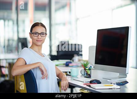 Developing tomorrows tech today. a designer at their workstation in an office. Stock Photo