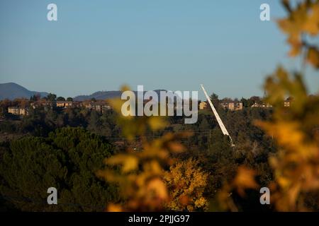 Redding, California, USA - November 22, 2021: Late afternoon sun shines on Sundial bridge in downtown Redding. Stock Photo