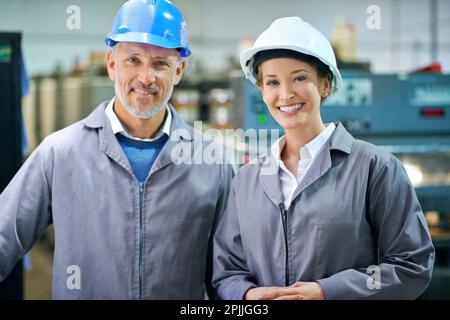 Your product is in experienced hands. Portrait of a people working inside a printing, packaging and distribution factory. Stock Photo
