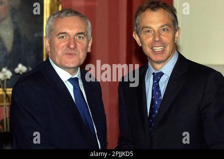 File photo dated 17/12/03 of then prime minister Tony Blair (right) and then Irish Taoiseach, Bertie Ahern, arriving at a meeting in Downing Street, London, for the first of a series of meetings with Mr Blair and Northern Ireland's pro-Good Friday Agreement parties. The former taoiseach regards lingering instability of Northern Ireland's political institutions as one of his biggest regrets from the Good Friday Agreement talks. Issue date: Monday April 3, 2023. Stock Photo