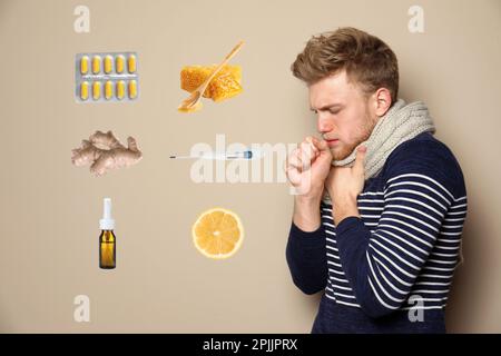 SIck man surrounded by different drugs and products for illness treatment on beige background Stock Photo