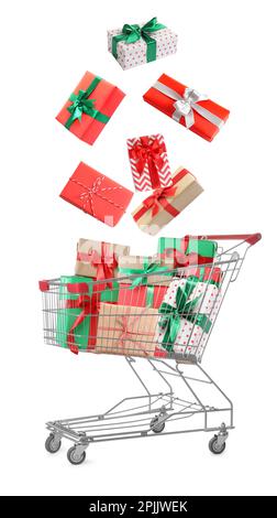 Beautifully wrapped gift boxes falling into metal shopping cart on white background Stock Photo