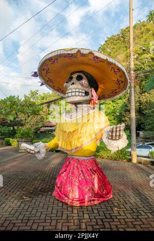 San Jose, Costa Rica - December 19, 2022: day opf dead figure in Costa rica with big mexican hat and colorful dress as traditional religious symbol Stock Photo