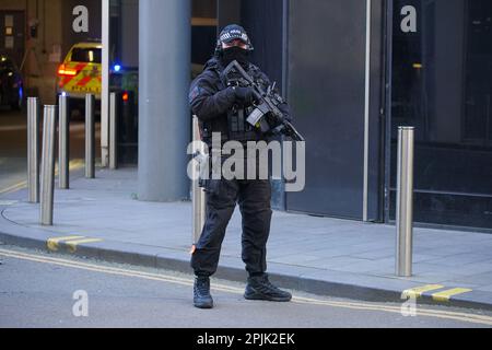 Armed police stand guard as a prison van arrives at at Manchester Crown Court where Thomas Cashman, 34, of Grenadier Drive, Liverpool, will be sentenced, for the murder of nine-year-old Olivia Pratt-Korbel, who was shot in her home in Dovecot on August 22 last year, the attempted murder of Joseph Nee, the wounding with intent of Olivia's mother Cheryl Korbel and two counts of possession of a firearm with intent to endanger life. Picture date: Monday April 3, 2023. Stock Photo