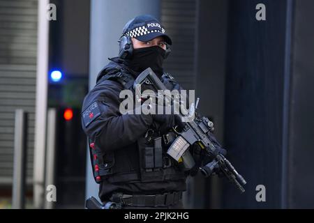 Armed police stand guard as a prison van arrives at at Manchester Crown Court where Thomas Cashman, 34, of Grenadier Drive, Liverpool, will be sentenced, for the murder of nine-year-old Olivia Pratt-Korbel, who was shot in her home in Dovecot on August 22 last year, the attempted murder of Joseph Nee, the wounding with intent of Olivia's mother Cheryl Korbel and two counts of possession of a firearm with intent to endanger life. Picture date: Monday April 3, 2023. Stock Photo