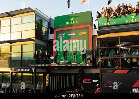 Melbourne, Australia. 02nd Apr, 2023. Max Verstappen of the Netherlands and Oracle Red Bull Racing, Lewis Hamilton of Great Britain and Mercedes-AMG PETRONAS Formula One Team and Fernando Alonso of Spain and Aston Martin Aramco Cognizant Formula One Team on the podium during the national anthem after the Formula One Australian Grand Prix at the Albert Park Circuit in Melbourne. (Photo by George Hitchens/SOPA Images/Sipa USA) Credit: Sipa USA/Alamy Live News Stock Photo