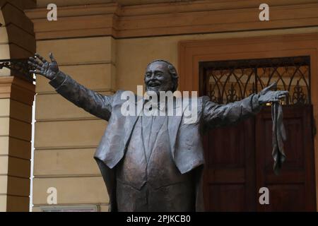 Modena, Italy, april 2023, bronze statue of Luciano Pavarotti tenor singer, touristic place, editorial Stock Photo