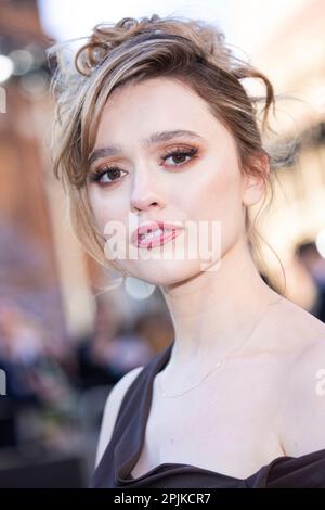 Aimee Lou Wood poses for photographers upon arrival at the Olivier