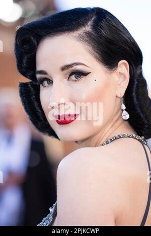 Dita Von Teese poses for photographers upon arrival at the Olivier