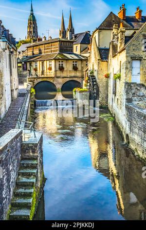 Colorful old buildings, Aure River reflection, Bayeux, Normandy, France. Bayeux founded 1st century BC, first city liberated after D-Day Stock Photo