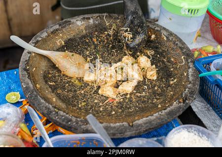 Tipat cantok is a Balinese local dish. It is made of various boiled or blanched vegetables with rice cake, served in spicy peanut sauce Stock Photo