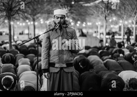 Black and white image of prayer and breaking fast during ramadan in London. Stock Photo