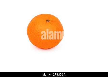 One orange tangerine as healthy food cropped against white background as studio shot Stock Photo