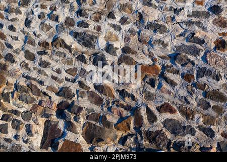 Stone Texture. An ancient wall of stones. Background. Template. Photo in high quality. Horizontal. Stock Photo