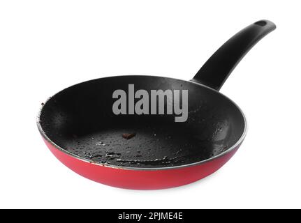 Dirty red frying pan isolated on white Stock Photo