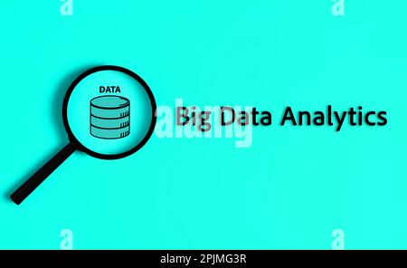 Big data analytics text with magnifier on blue background Stock Photo