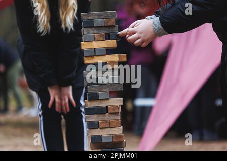 Jenga tower game in nature. Close-up shot of Jenga wooden block game ...